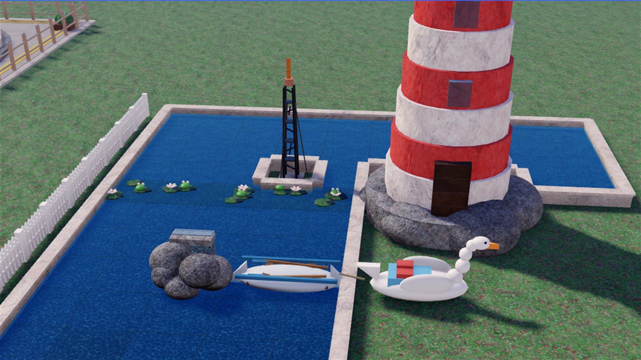 A rowing boat floating on a park lake beside a lighthouse
