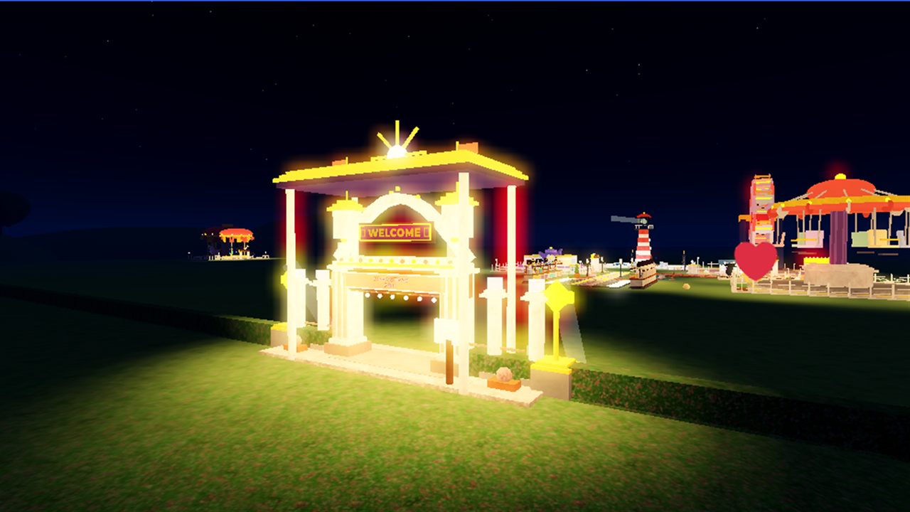 The glowing WELCOME entrance arch at night