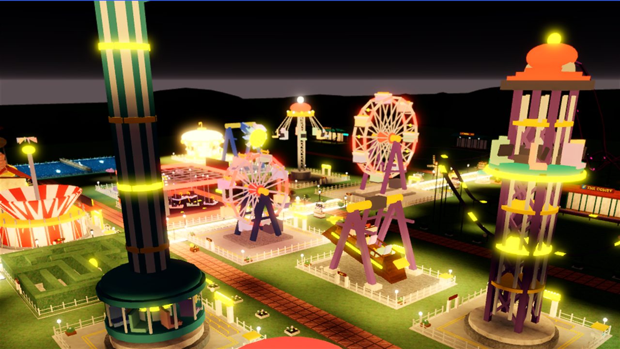 A large park at night: drop tower, teacups, ferris wheel, hedge maze and coaster, all lit up
